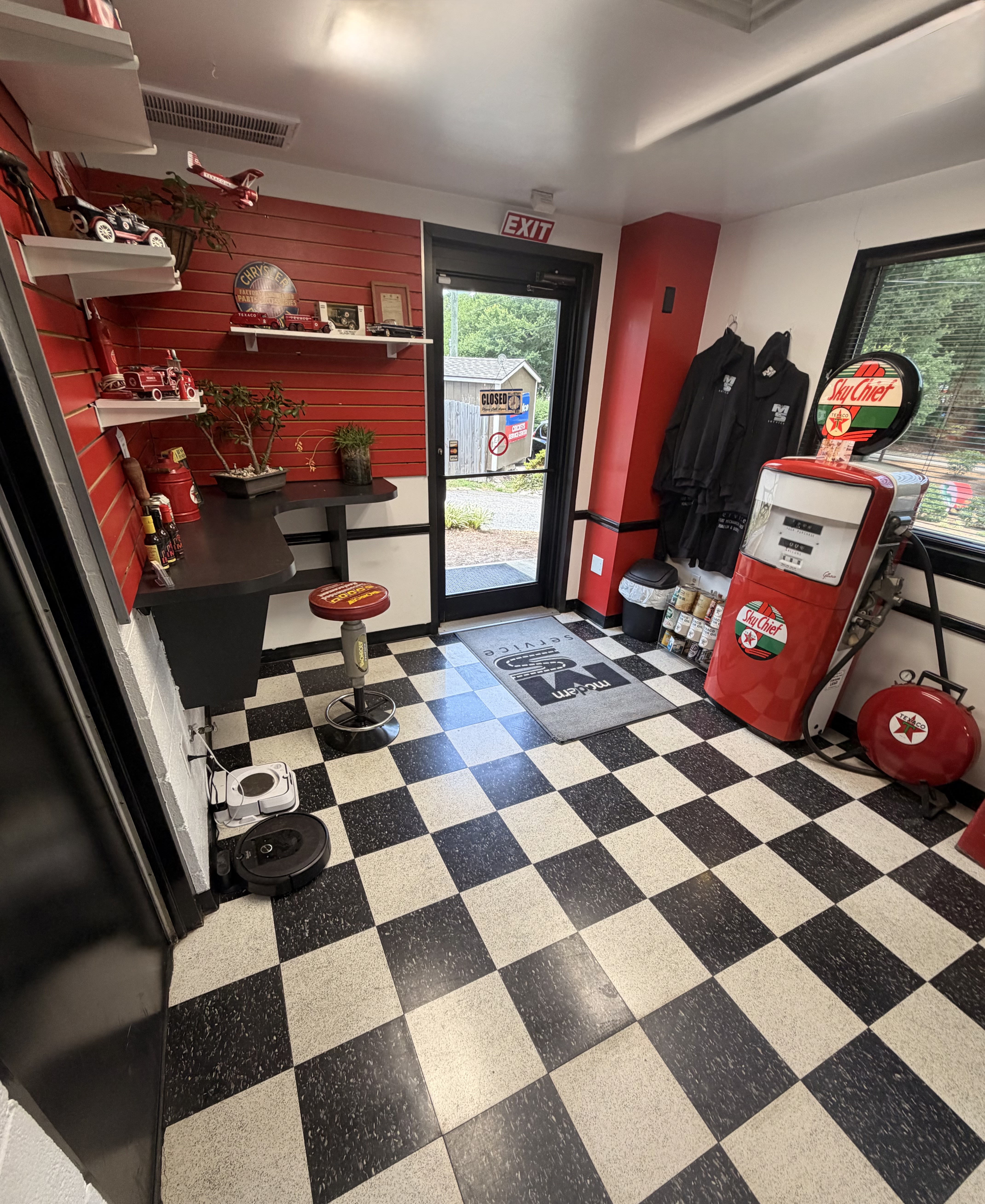 Modern Service waiting room with classic checkerboard floor and vintage Texaco pump